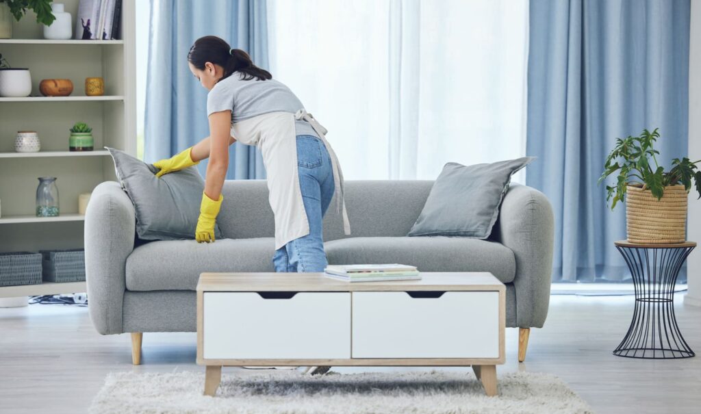 woman cleaning living room